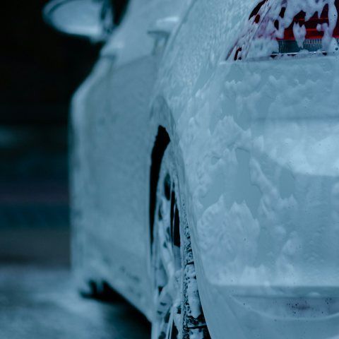 Car covered in wash foam